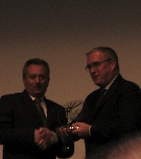 UCI President Pat McQuaid awarding something to someone